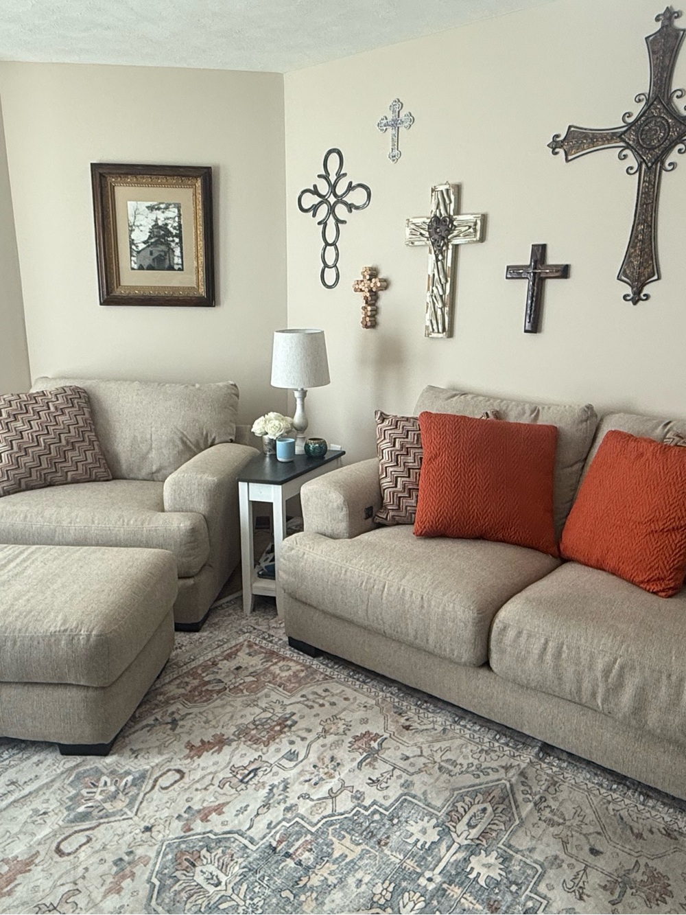 Neutral Beige Two-Seater Sofa with Orange Accent Pillows